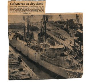 Newspaper photo of USS Calcaterra in dry dock
