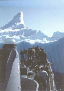 Lining up to paint the ship's name on the iceberg