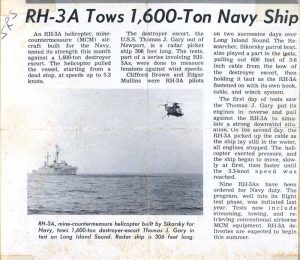USS Thomas J Gary being towed by a helicopter