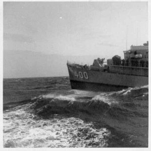 Neat shot of USS Hissem riding the seas